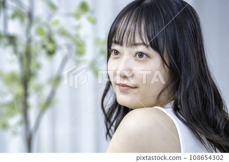 Young lady with tank top Young lady with tank top 108654302