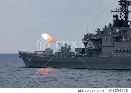 A Maritime Self-Defense Force escort ship firing its main guns during a training display A Maritime Self-Defense Force escort ship firing its main guns during a training display 108654328