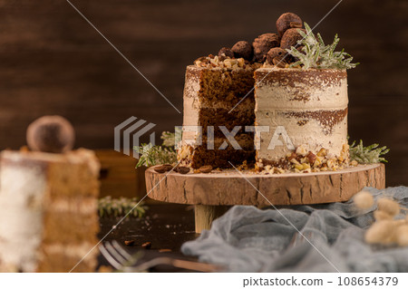 Slice of delicious naked coffee and hazelnuts cake Slice of delicious naked coffee and hazelnuts cake 108654379