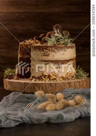 Slice of delicious naked coffee and hazelnuts cake 108654384