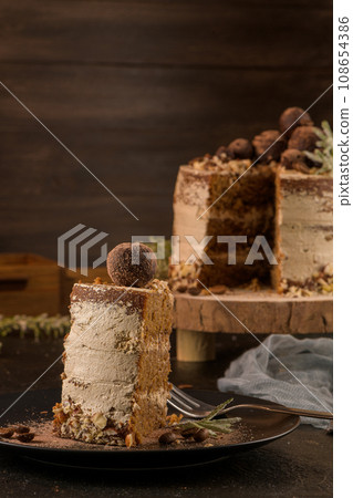 Slice of delicious naked coffee and hazelnuts cake 108654386