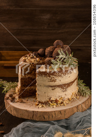 Slice of delicious naked coffee and hazelnuts cake 108654396