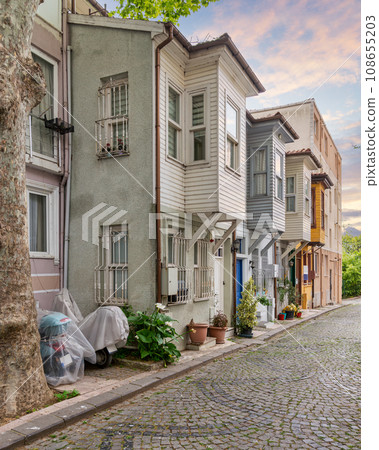 Cobblestone alley with colorful wooden houses, suited in Kuzguncuk neighborhood, Uskudar district, Istanbul, Turkey Cobblestone alley with colorful wooden houses, suited in Kuzguncuk neighborhood, Uskudar district, Istanbul, Turkey 108655203
