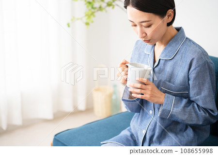 Young woman in pajamas lifestyle image 108655998