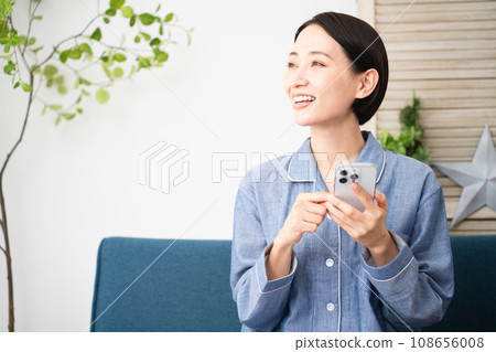 Young woman in pajamas lifestyle image Young woman in pajamas lifestyle image 108656008