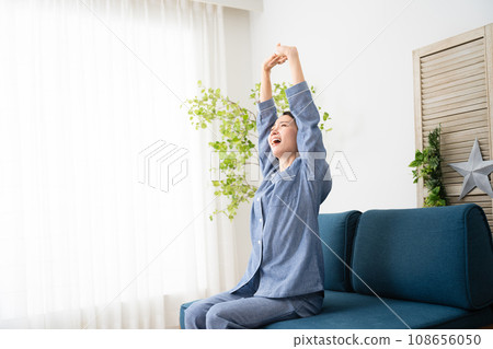 Young woman in pajamas lifestyle image 108656050