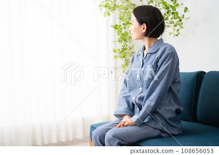 Young woman in pajamas lifestyle image 108656053