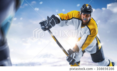 Sport emotion. Hockey close up. Hockey action. Professional hockey players playing hockey on a rink in mountain Sport emotion. Hockey close up. Hockey action. Professional hockey players playing hockey on a rink in mountain 108656166