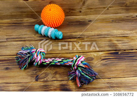Dog's toys on a wooden background Dog's toys on a wooden background 108656772