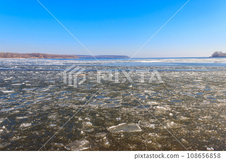 View of a lake with melting ice at spring View of a lake with melting ice at spring 108656858
