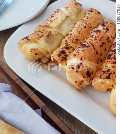 Delicious baked cheese rolls, baked crunchy cheese bread on an catering event, selected focus, cheese wrapped in bread and baked 108657030