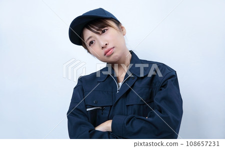 Image of a woman wearing troubled work clothes Image of a woman wearing troubled work clothes 108657231