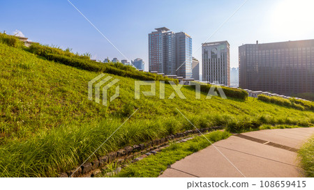 Sunset over the Namsan Park walkway with modern skyscrapers in Seoul, South Korea 108659415