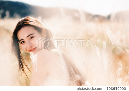 Beauty image of a woman in pampas grass Beauty image of a woman in pampas grass 108659900