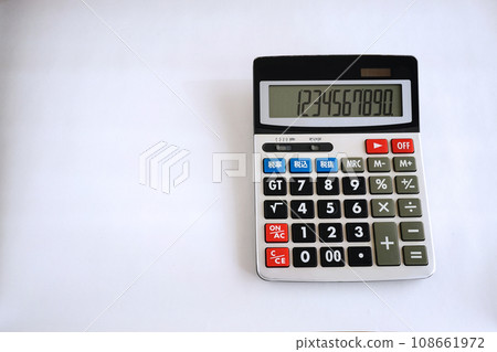 Calculator placed on a white desk 108661972