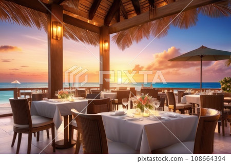 Outdoor restaurant at the beach. Table setting at tropical beach restaurant. beautiful sunset sky, sea view. Luxury hotel or resort restaurant. AI 108664394