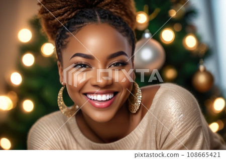 Close Up portrait smiling happy African American female laughing, looking at camera, posing on Christmas tree background at home, blogger shooting vlog, having fun. AI 108665421