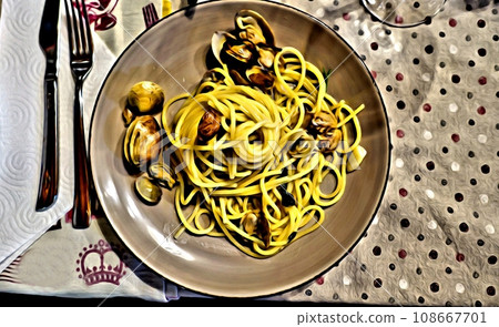 A plate of spaghetti with Mediterranean clams. A plate of spaghetti with Mediterranean clams. 108667701