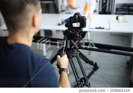 Videographer is filming doctor in clinic closeup Videographer is filming doctor in clinic closeup 108668244
