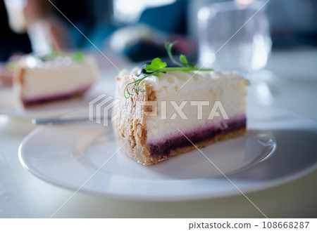 Piece of delicious cottage cheese cake with jam on plate Piece of delicious cottage cheese cake with jam on plate 108668287