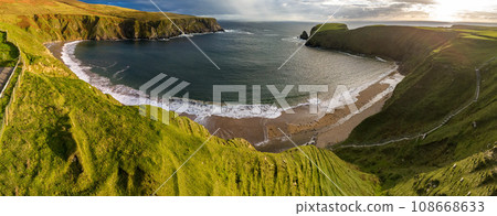 Aerial view of the beautiful coast at Malin Beg in County Donegal, Ireland Aerial view of the beautiful coast at Malin Beg in County Donegal, Ireland 108668633