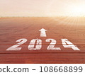 New year 2024. Text of 2024 has written on the ground. Straight forward concept. Keep going to the goal. target and challenge. 108668899