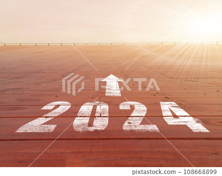 New year 2024. Text of 2024 has written on the ground. Straight forward concept. Keep going to the goal. target and challenge. New year 2024. Text of 2024 has written on the ground. Straight forward concept. Keep going to the goal. target and challenge. 108668899