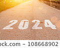 New year 2024. Text of 2024 has written on the ground. 108668902