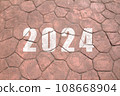New year 2024. Text of 2024 has written on the ground. 108668904