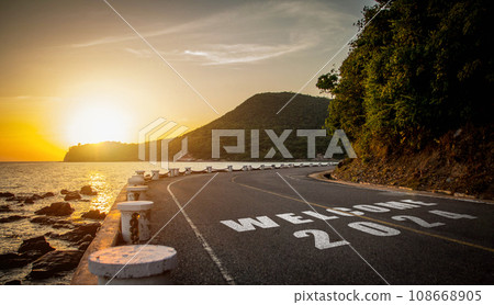 New year 2024. Text of 2024 has written on the ground in the hightlight of the evening sunset. New year 2024. Text of 2024 has written on the ground in the hightlight of the evening sunset. 108668905