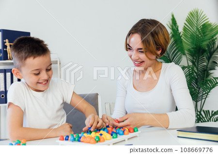 female psychologist develops boy fine motor skills development learning female psychologist develops boy fine motor skills development learning 108669776