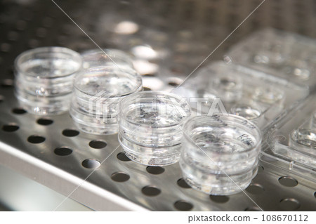 Closeup of lab equipment for scientific research with fluids Closeup of lab equipment for scientific research with fluids 108670112