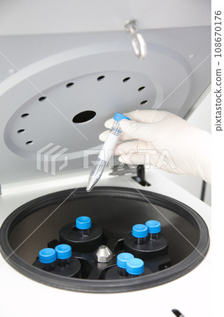 Closeup of lab equipment for scientific research with fluids Closeup of lab equipment for scientific research with fluids 108670176
