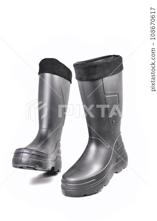 black high insulated boots for hunting off-road fishing and traveling in the cold season on a white background isolate 108670617