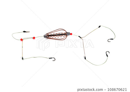 fishing trough, fishing hooks and fishing line, accessories for bottom fishing on a white background close-up 108670621