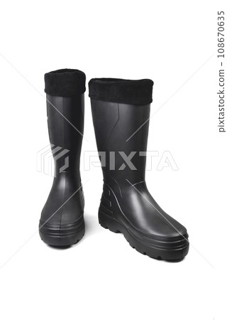 black high insulated boots for hunting off-road fishing and traveling in the cold season on a white background isolate 108670635