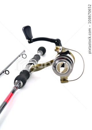 fishing reel on a fishing rod, white background close-up fishing reel on a fishing rod, white background close-up 108670652
