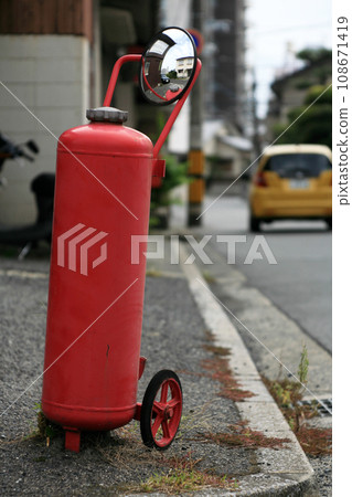 yellow car with fire extinguisher curved mirror yellow car with fire extinguisher curved mirror 108671419