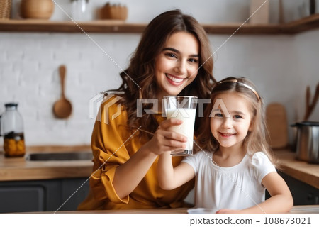 Happy positive Cousin and Daughter drinking milk in workshop, holding glasses, keeping healthy hydration, diet, lifestyle, carin . Caring for family health, wellbeing. AI 108673021