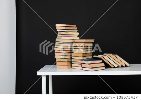 stack of books on a black background science education culture training stack of books on a black background science education culture training 108673417