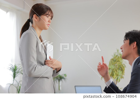 A boss yells at a subordinate who gives a bad report 2 A boss yells at a subordinate who gives a bad report 2 108674904