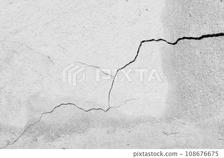 An old wall with a cracked texture is decorated with cement mortar An old wall with a cracked texture is decorated with cement mortar 108676675