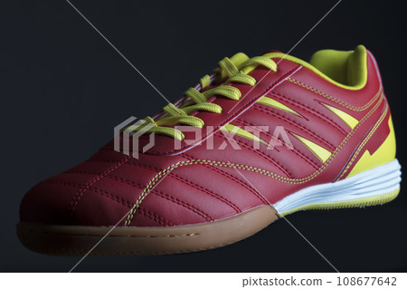 Red sneaker on a black background. Sport shoes Red sneaker on a black background. Sport shoes 108677642