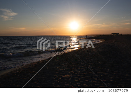 beautiful sunset on a sandy beach near the ocean. great background for design beautiful sunset on a sandy beach near the ocean. great background for design 108677979