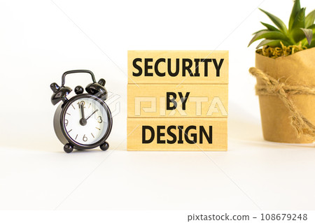 Security by design symbol. Concept words Security by design on wooden blocks on a beautiful white table white background. Black alarm clock. Business, finacial security by design concept. Copy space. Security by design symbol. Concept words Security by design on wooden blocks on a beautiful white table white background. Black alarm clock. Business, finacial security by design concept. Copy space. 108679248