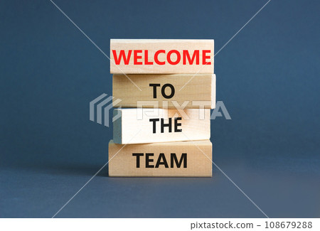 Welcome to the team symbol. Concept words Welcome to the team on wooden block. Beautiful white table white background. Business, motivational and welcome to the team concept. 108679288