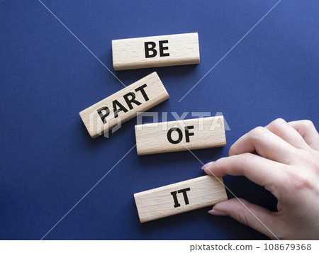 Be part of it symbol. Concept words Be part of it on wooden blocks. Beautiful deep blue background. Businessman hand. Business and Be part of it concept. Copy space. 108679368