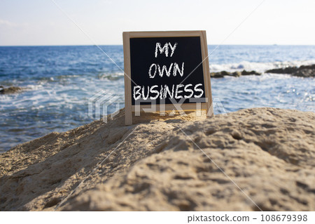 My own Business symbol. Concept words My own Business on chalk blackboard. Beautiful sea background. Business and My own Business concept. Copy space. My own Business symbol. Concept words My own Business on chalk blackboard. Beautiful sea background. Business and My own Business concept. Copy space. 108679398