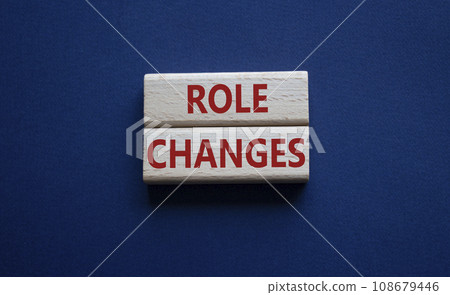Role changes symbol. Concept words Role changes on wooden blocks. Beautiful deep blue background. Business and Role changes concept. Copy space. Role changes symbol. Concept words Role changes on wooden blocks. Beautiful deep blue background. Business and Role changes concept. Copy space. 108679446