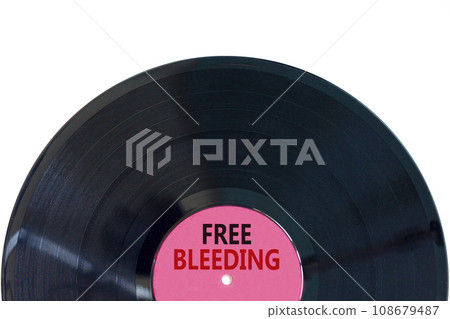 Free bleeding symbol. Concept words Free bleeding on beautiful black old retro vinyl disc. Beautiful white table white background. Gen Z, motivational, freedom free bleeding concept. Copy space. Free bleeding symbol. Concept words Free bleeding on beautiful black old retro vinyl disc. Beautiful white table white background. Gen Z, motivational, freedom free bleeding concept. Copy space. 108679487